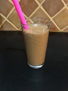 banana cacao smoothie with straw