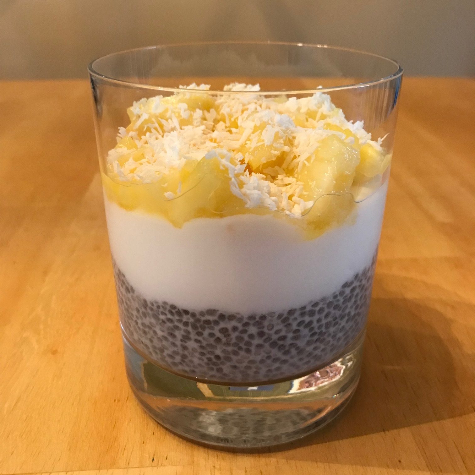 Chia pudding parfait with pineapple and shredded coconut